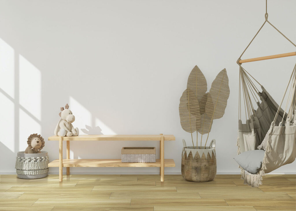 Empty white wall in modern child room. Mock up interior in scandinavian, boho style. Copy space for your picture or poster. Console, hanging armchair, rattan basket. Cozy room for kids. 3D rendering